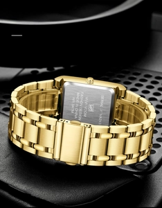 Detailed view of the brushed stainless steel case back of the square gold business watch