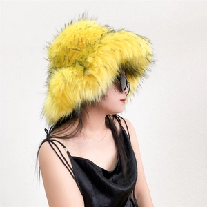 Close-up of bright yellow fluffy faux fur bucket hat with thick plush texture detail