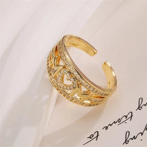Macro detail of gold plated MOM ring with micro-pave cubic zirconia heart and letters