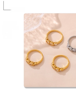 Detailed close-up of gold and silver minimalist stackable rings with set zircon stones