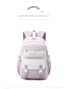 Front detail of purple and white school backpack with functional buckles and large compartments