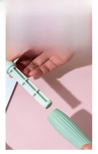 Detail view of a detachable light green hair comb handle made of durable PP material.