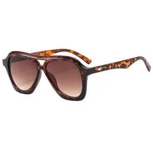 Fashion aviator sunglasses with tortoise shell frame and brown gradient lenses