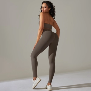 Detail view of seamless backless yoga set featuring high-waisted leggings and halter sports bra