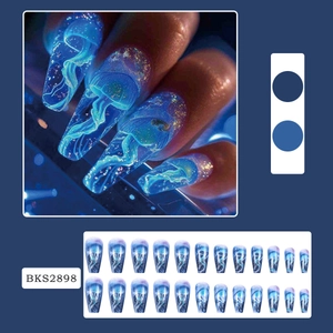 Blue starry ocean press-on nails with luminous jellyfish design in long ballerina shape