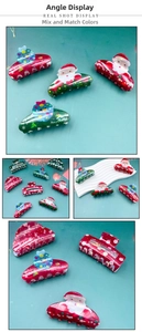 Detail view of PVC Christmas hair claws with glittery Santa and Snowman prints