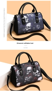 Close-up of skull floral print on oxford fabric barrel bag with leather handles