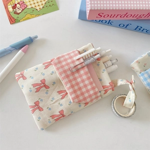 Close-up of floral nurse pocket pen pouch showing side hanging loop for tape storage