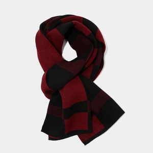 Detail of red and black checkered knit scarf with thick buffalo plaid texture