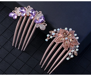 Detail of purple butterfly and champagne flower hair combs with sparkling rhinestones