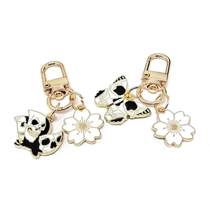 Fashion skull butterfly and cherry blossom keychains with gold metal and enamel finish