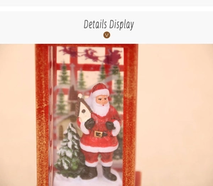 Detail of Christmas lantern with Santa Claus figurine holding a birdhouse and a tree