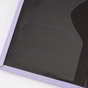 Detail of purple passport holder with precise stitching and transparent PVC card slots