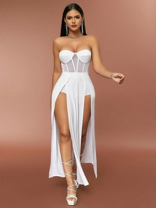 Detail of white tube maxi dress with mesh waist panel and high slit design