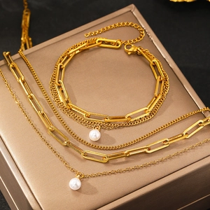Three-layer gold metal chain necklace and bracelet set with elegant white pearl pendants