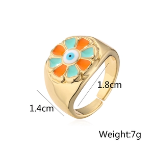 Detail of 18K gold plated flower ring with evil eye enamel and adjustable band size
