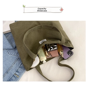 Internal view of dark green canvas tote bag showing large capacity for daily items