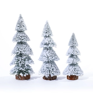 Set of three mini flocked cedar Christmas trees with natural wood bases for table decor