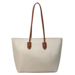 Chic cream tote bag with brown straps, spacious minimalist faux leather shoulder bag for women