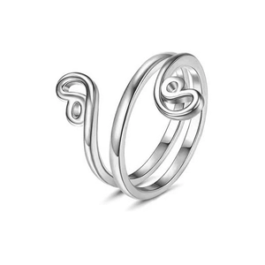 Macro detail of silver adjustable spiral toe ring with polished finish for summer beach style