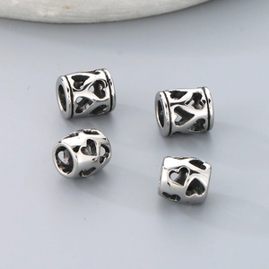 Perles d'espacement cylindriques ajourées en forme de cœur en acier pour bijoux DIY