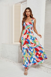 Close-up of the square neckline and vibrant abstract print on this tiered maxi dress