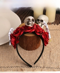 Gothic Halloween headband detail with red roses and miniature resin skull and skeleton hands