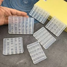 Close-up of clear silicone molds for DIY nail art featuring Japanese Hiragana characters