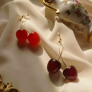Chic cherry drop earrings in bright red and deep burgundy resin with gold stems