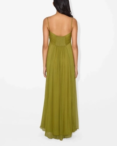 Close-up of olive green maxi dress featuring elastic smocked back and flowing chiffon fabric