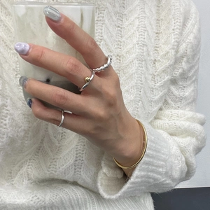 Minimalist S925 sterling silver twisted ring set with gold bead accent and bracelet