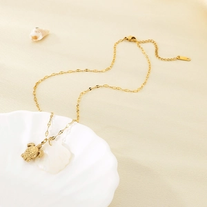 18K gold plated stainless steel necklace featuring a sea turtle and white shell pendant
