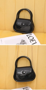 Glossy black mini jelly bag with large round buckle and detachable gold chain strap