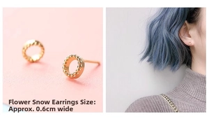 Detail view of 0.6cm gold hoop earrings with textured edge and model ear shot