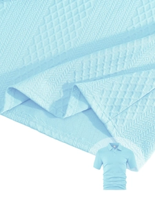 Close-up of the light blue men's polo shirt featuring geometric textured knit fabric