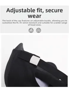 Détail de la casquette noire avec boucle métallique réglable et texture en coton sergé