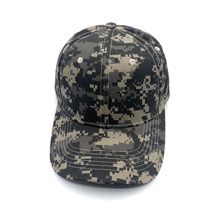 Close-up of the digital camouflage pattern and stitching on a six-panel baseball cap