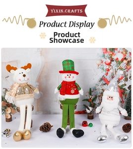 Detailed close-up of plush Christmas dolls with sequins, knit fabric, and fur trim details