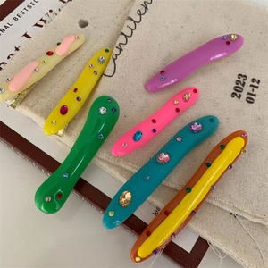 Colorful acrylic duckbill hair clips with sparkling rhinestones in various vibrant shades