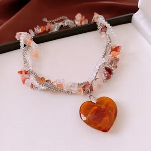 Multi-layered stone and glass beaded heart necklace with luxury crystal accents