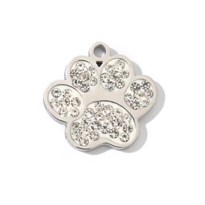 Macro shot of silver paw pendant with sparkling rhinestones and a polished finish