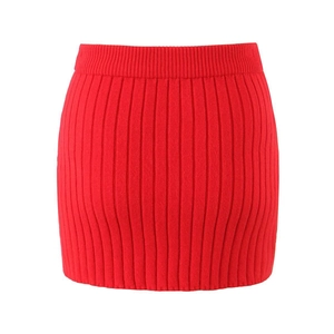 Detail view of red ribbed knit texture on a high-waisted pencil skirt fabric