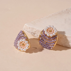 Vintage gold-toned flower earrings with purple beads and white imitation pearls