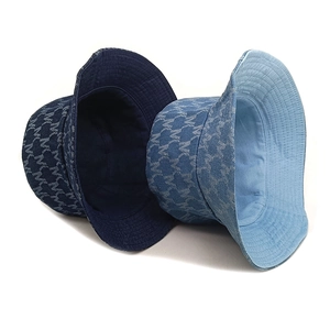 Classic washed denim bucket hat with monogram M pattern in dark and light blue