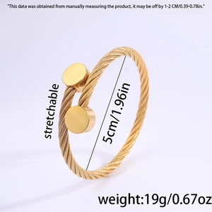 Detail view of a gold-plated twisted cable bracelet showing 5cm diameter and weight
