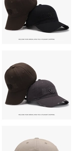 Detail of vintage washed cotton baseball caps with distressed edges and 3D letter embroidery