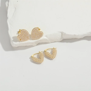 Elegant heart and V-shaped gold earrings with paved white pearls for women banquet