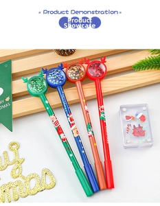 Close-up of Christmas pens featuring reindeer antler tops with glitter sequins inside