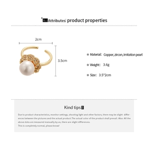 Detailed view of the 3.5cm flower ring with pearl, zircons, and dimensions info