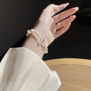 Close-up of baroque freshwater pearl bracelet with a classic silver OT toggle clasp